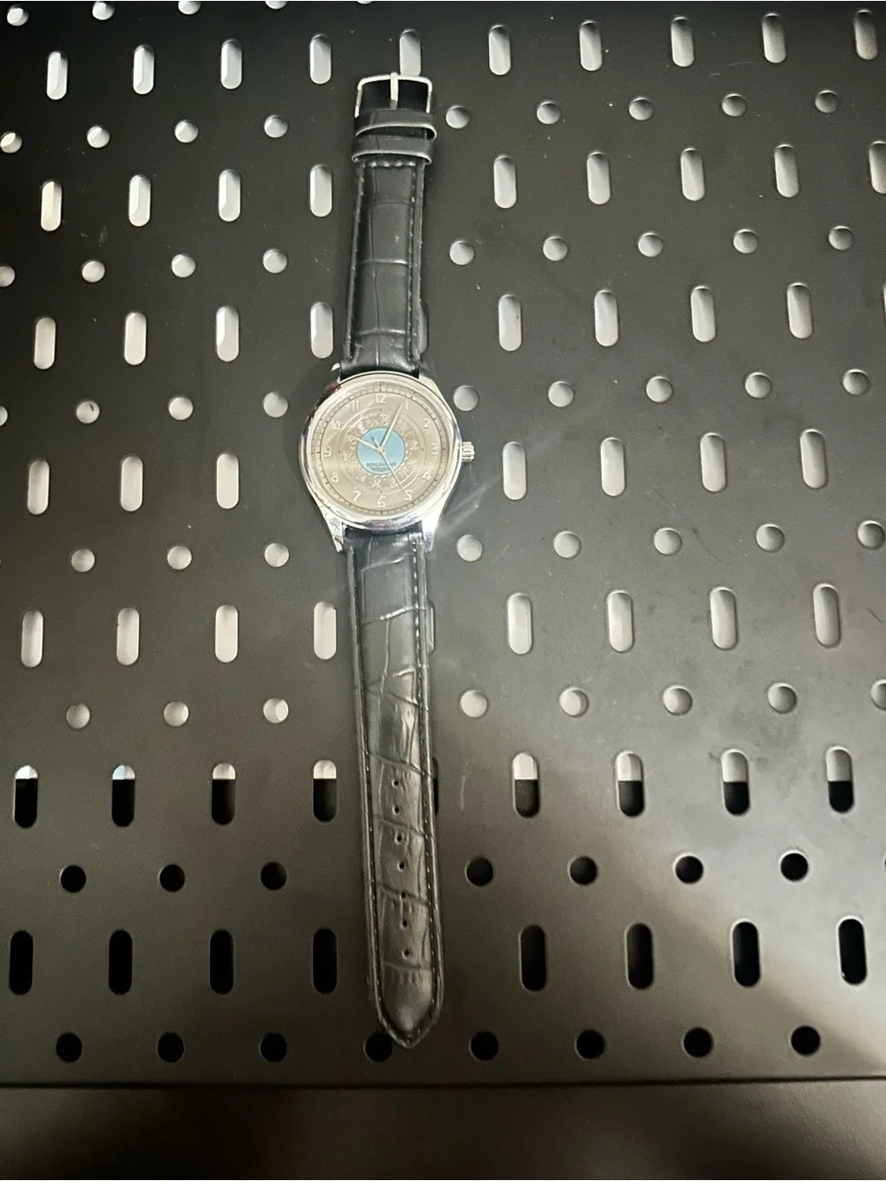 Men's Silver Watch with Black Leather Strap and Light Blue Dial Accent